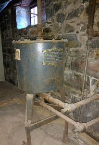 This Gilbert & Barker Combination Mixing Regulator, probably part of the Springfield Gas Machine, is in the library basement. Long disconnected to the gas tank outside, it mixed gas and air in order to deliver gas of a uniform quality to the lighting system.