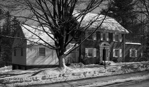 This building, part brick and part wooden frame, will have two apartments. Photo by Bruce Frisch.