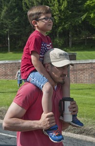 A young spectator gets a clear view.