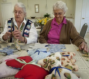 Phylis Bernard and Barbara Mulville making plush bears.