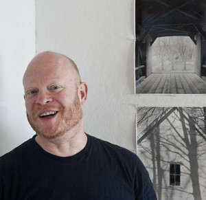 Photographer Jim Jasper in his studio in Norfolk with two photos from his current show.