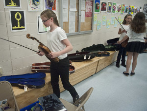 String players prepare to go onstage.