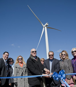 Gregory Zupkus and Paul Corey, principals of BNE Energy, prepare to cut the inaugural ribbon at the Colebrook South wind farm, flanked by Bryan Garcia, CEO of Connecticut Green Bank, far left, State Representative Lezlye Zupkus, third from left, and State Representative Lonnie Reed, far right.