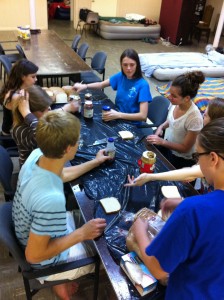 Boston work campers make 150 sandwiches to be served the next morning to hungry people downtown. Photo by Erick Olsen.