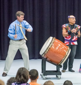 Matthew O'Connell, principal of Botelle School, beats the big drum.