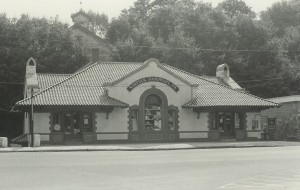 The old hardware store with its elaborate silhouette and tiled roof before the 1987 fire.