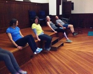 Performing stomach crunches in Battell Chapel.